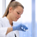 Researcher working in an APS member's lab