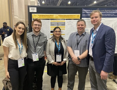 Durocher, second from right, with his lab group at the 2022 Experimental Biology conference.