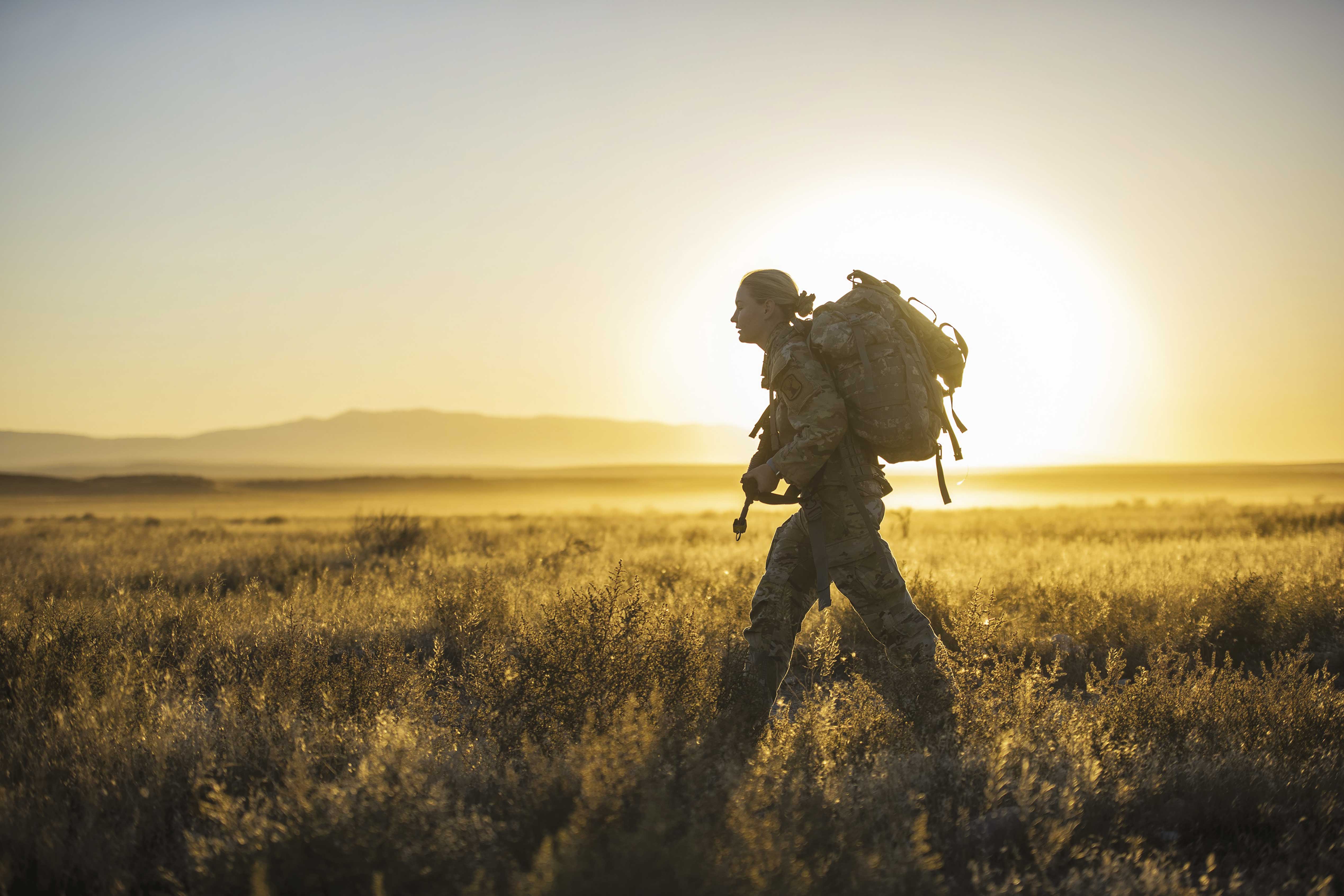 Idaho Army National Guard Staff Sgt. Lauren Cox during an 11-mile trek with a 40-pound pack in Idaho in September.