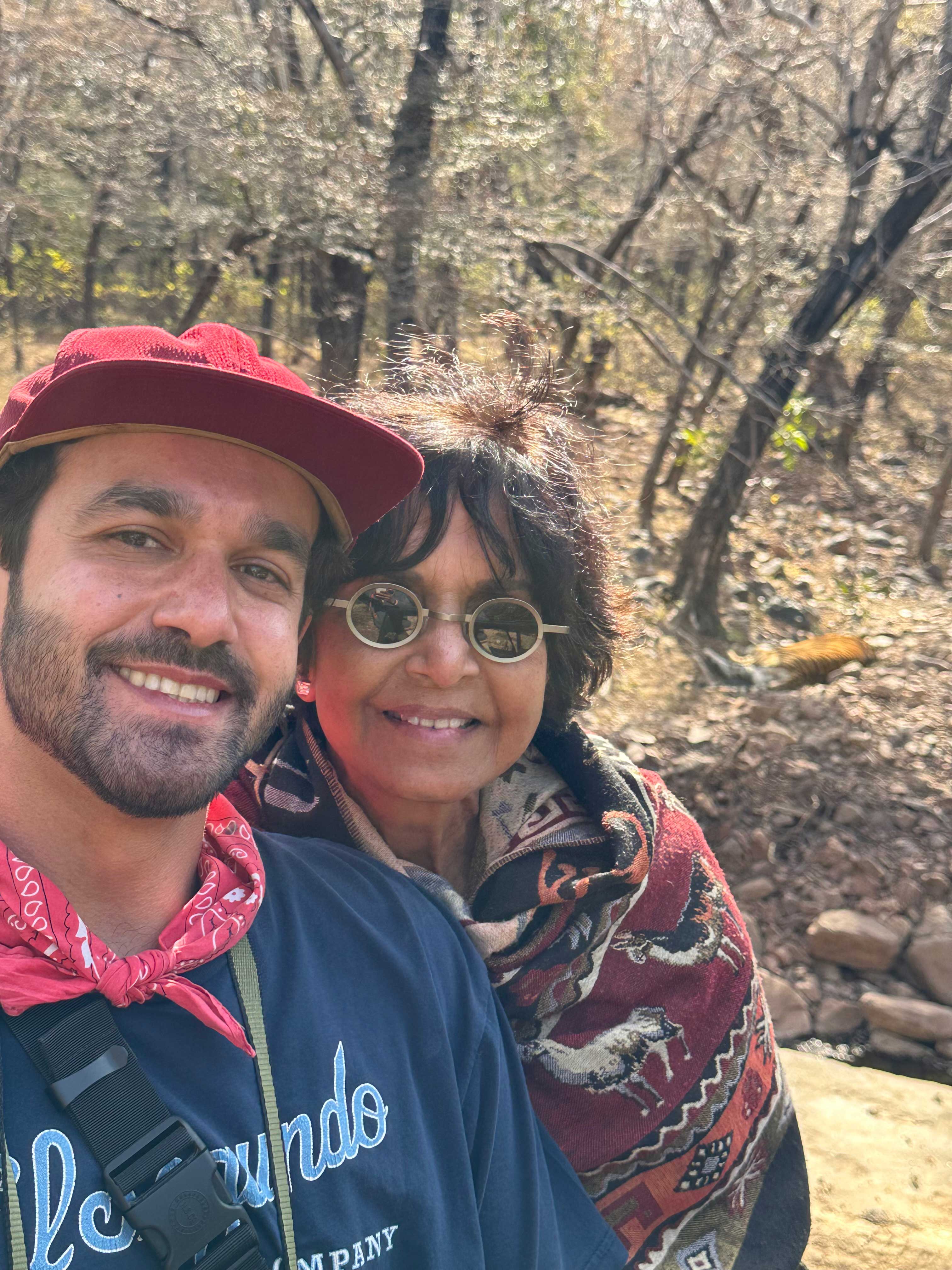 Feature_Art-and-Science_son-Danny Raj stands with her son with a backdrop of woods