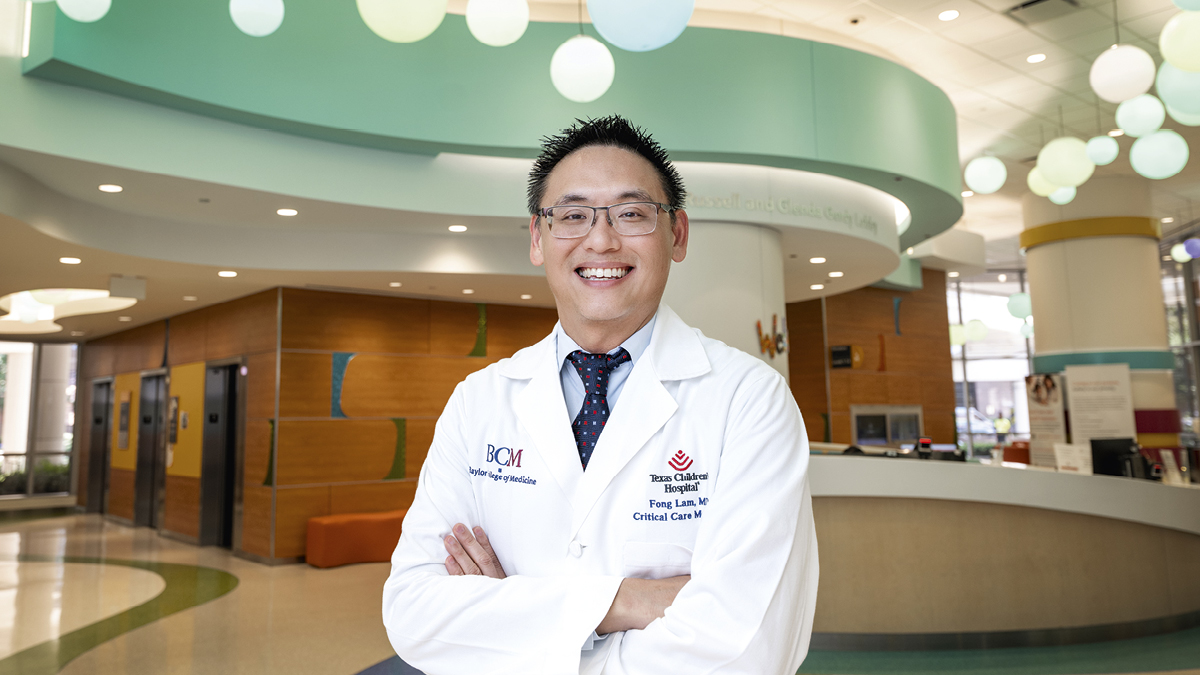 a man standing in the lobby of a medical facility