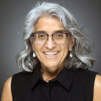 A professional photo of Alice Villalobos, PhD